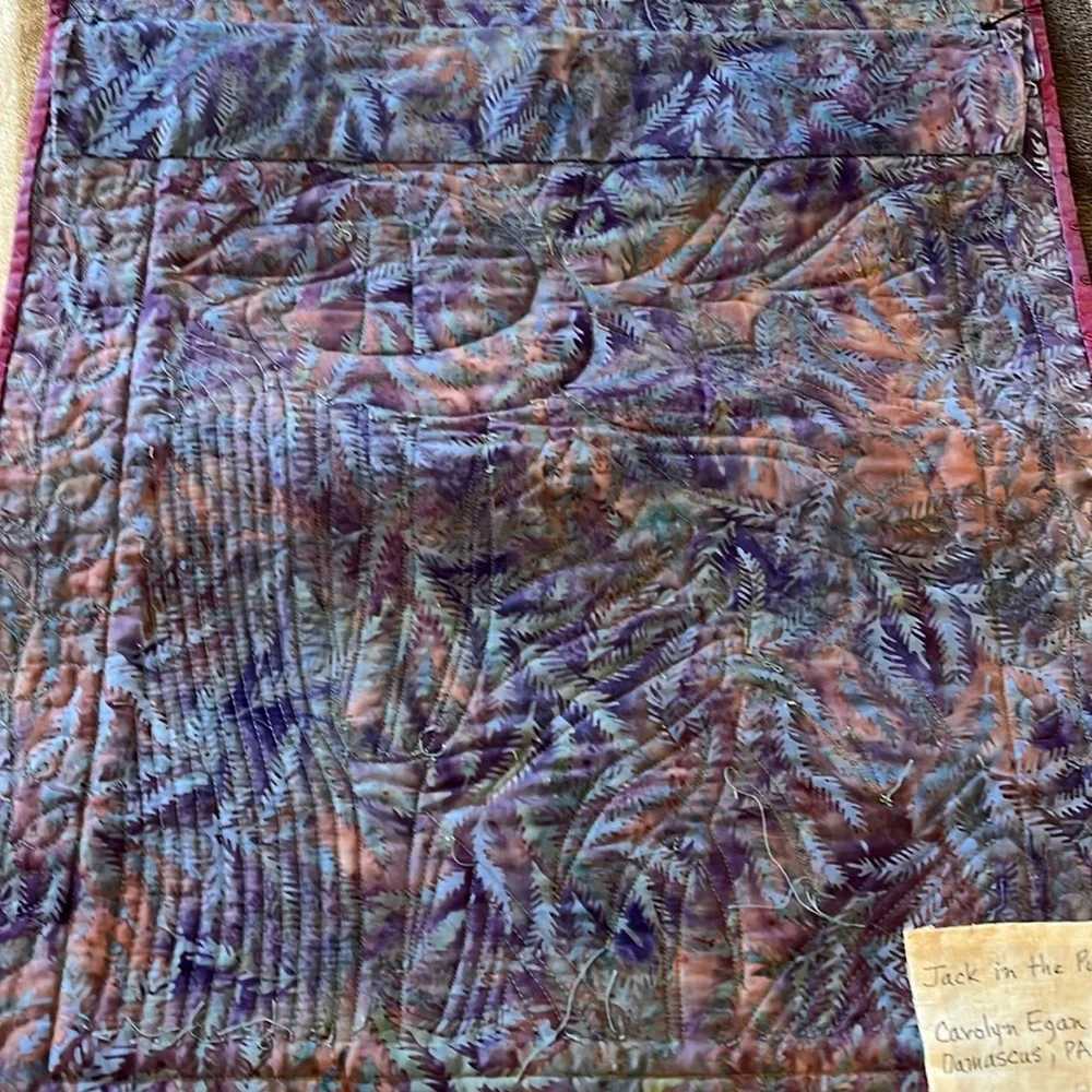 Homemade quilted wall hanging.